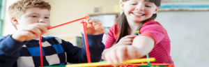 Kids Building with Plastic Sticks