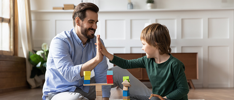 Dad and son high five